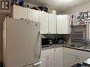 2102-2104 Rothwell Street, Regina, SK  - Indoor Photo Showing Kitchen With Double Sink 