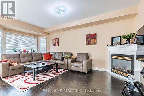 12 Pappain Crescent S, Brampton, ON - Indoor Photo Showing Living Room With Fireplace