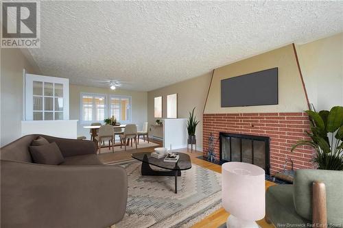 21 Richard Avenue, Bouctouche, NB - Indoor Photo Showing Living Room With Fireplace