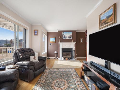 10-4404 Pleasant Valley Road, Vernon, BC - Indoor Photo Showing Living Room With Fireplace