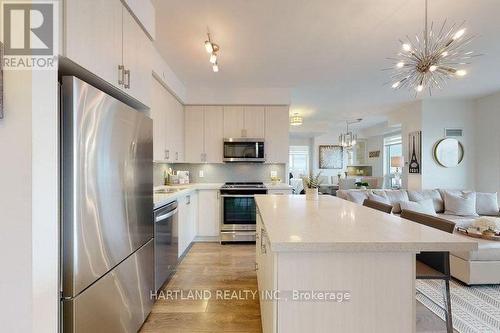 703 - 4655 Glen Erin Drive E, Mississauga (Central Erin Mills), ON - Indoor Photo Showing Kitchen With Upgraded Kitchen