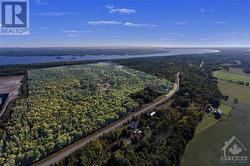 Highlighted area is the property.  (light green).  123.6 acres.  Ottawa River in background. - 