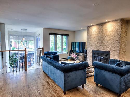 Living room - 3639 Rue Charron, Laval (Saint-Vincent-De-Paul), QC - Indoor Photo Showing Living Room With Fireplace