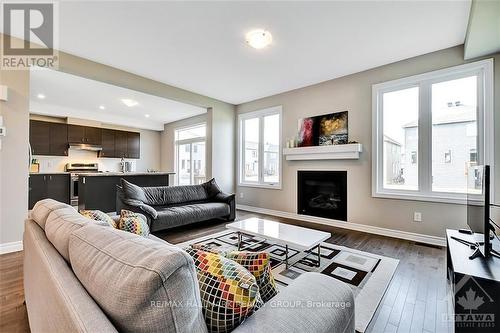 210 Kimpton Drive, Ottawa, ON - Indoor Photo Showing Living Room With Fireplace