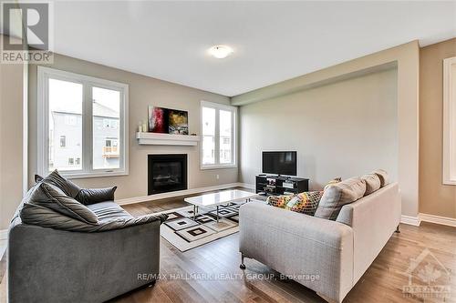 210 Kimpton Drive, Ottawa, ON - Indoor Photo Showing Living Room With Fireplace