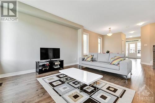 210 Kimpton Drive, Ottawa, ON - Indoor Photo Showing Living Room With Fireplace