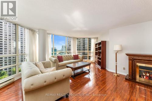 1204 - 45 Kingsbridge Garden Circle, Mississauga (Hurontario), ON - Indoor Photo Showing Living Room With Fireplace