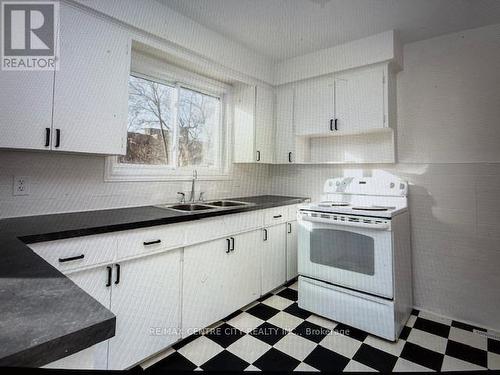 187 Black & white Kitchen, plus pantry closet. - 187-189 Taylor Street, London, ON - Indoor Photo Showing Kitchen With Double Sink