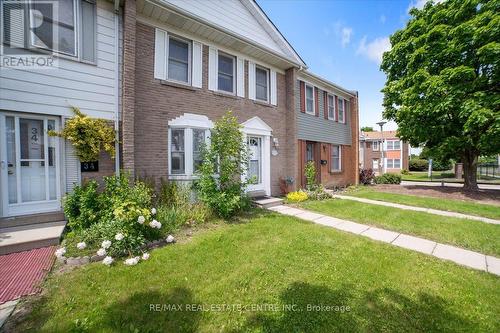 33 - 1020 Central Park Drive, Brampton, ON - Outdoor With Facade