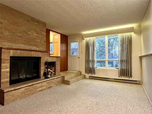 222 Buckingham Street, Boissevain, MB - Indoor With Fireplace