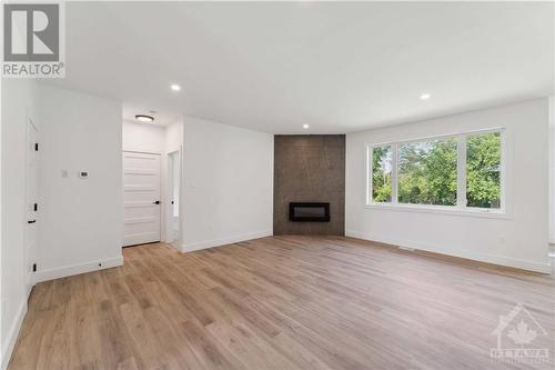 78 Colonel Murray Street S, Richmond, ON - Indoor Photo Showing Other Room With Fireplace