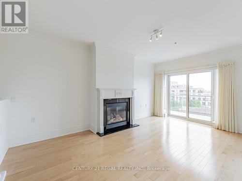 Ph7 - 12 Rean Drive, Toronto, ON - Indoor Photo Showing Living Room With Fireplace