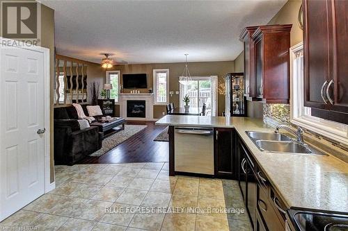 1152 Oakcrossing Road, London, ON - Indoor Photo Showing Kitchen With Fireplace With Double Sink