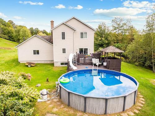 Back facade - 340 Ch. Remick, Stanstead - Canton, QC - Outdoor With Above Ground Pool With Backyard