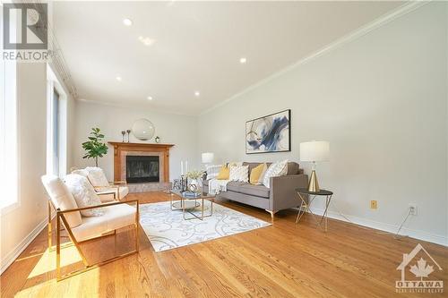 Bright family room with fireplace - 42 Marchbrook Circle, Kanata, ON - Indoor Photo Showing Living Room With Fireplace