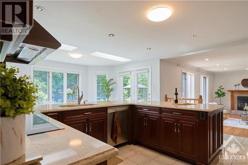 42 Marchbrook Circle, Kanata, ON - Indoor Photo Showing Kitchen With Fireplace