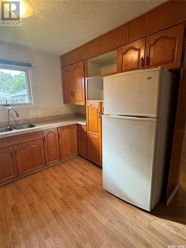 113 12Th Street, Weyburn, SK - Indoor Photo Showing Kitchen With Double Sink