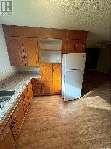 113 12Th Street, Weyburn, SK - Indoor Photo Showing Kitchen With Double Sink