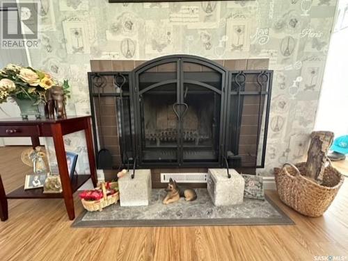 303 Dominion Bay, Central Butte, SK - Indoor Photo Showing Living Room With Fireplace