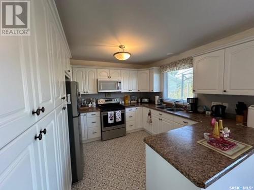 303 Dominion Bay, Central Butte, SK - Indoor Photo Showing Kitchen With Double Sink