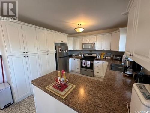 303 Dominion Bay, Central Butte, SK - Indoor Photo Showing Kitchen With Double Sink