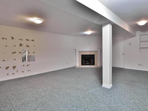 Basement - 239 Rue Blue Haven, Dollard-Des-Ormeaux, QC - Indoor Photo Showing Other Room With Fireplace