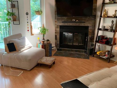 Living room - 330 Ch. Des Épinettes, Piedmont, QC - Indoor Photo Showing Living Room With Fireplace