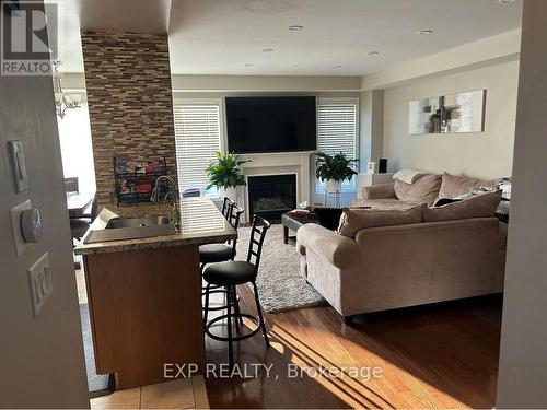 4236 Thomas Alton Boulevard, Burlington, ON - Indoor Photo Showing Living Room With Fireplace