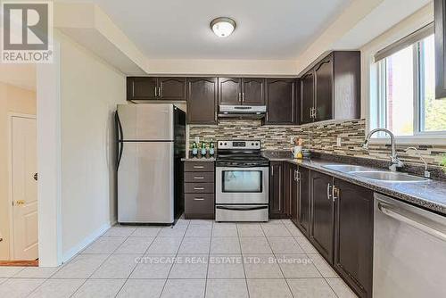 209 Queen Mary Drive, Brampton (Fletcher'S Meadow), ON - Indoor Photo Showing Kitchen With Double Sink