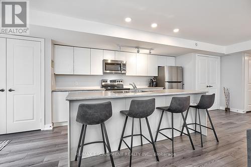 101 - 3058 Sixth Line, Oakville, ON - Indoor Photo Showing Kitchen With Stainless Steel Kitchen With Upgraded Kitchen