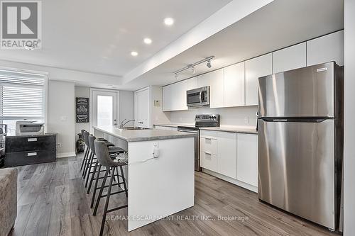 101 - 3058 Sixth Line, Oakville, ON - Indoor Photo Showing Kitchen With Stainless Steel Kitchen