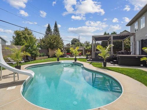 Backyard - 45 Rue Jean-Paul-Lemieux, Notre-Dame-De-L'Île-Perrot, QC - Outdoor With In Ground Pool With Backyard