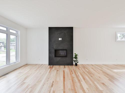 Living room - 1223 Rue Des Îles, Saint-Jérôme, QC - Indoor With Fireplace