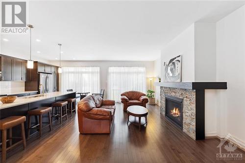 219 Pingwi Place, Ottawa, ON - Indoor Photo Showing Living Room With Fireplace