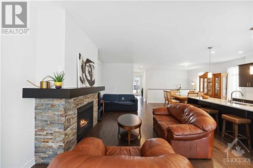 219 Pingwi Place, Ottawa, ON - Indoor Photo Showing Living Room With Fireplace