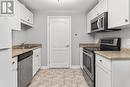 113 - 6350 Dorchester Road E, Niagara Falls (Dorchester), ON  - Indoor Photo Showing Kitchen With Double Sink 