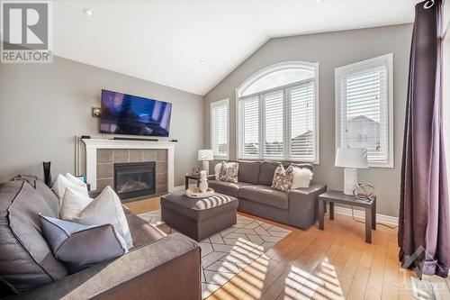 64 Hartsmere Drive, Ottawa, ON - Indoor Photo Showing Living Room With Fireplace