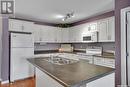 110 600 Centennial Boulevard, Warman, SK  - Indoor Photo Showing Kitchen With Double Sink 