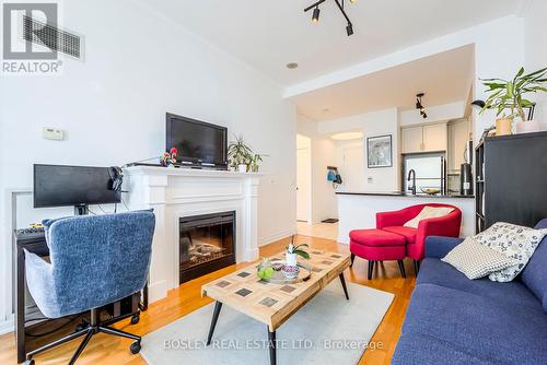 Ph09 - 2083 Lake Shore Boulevard W, Toronto (Mimico), ON - Indoor Photo Showing Living Room With Fireplace