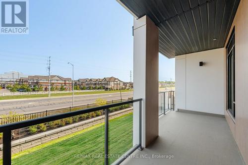 210 - 1440 Clarriage Court, Milton (Ford), ON - Outdoor With Balcony With Exterior