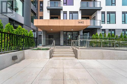 210 - 1440 Clarriage Court, Milton, ON - Outdoor With Balcony With Facade