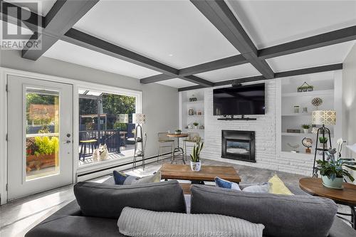 210 Laurier Drive, Lasalle, ON - Indoor Photo Showing Living Room With Fireplace