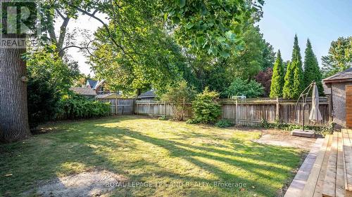 Surrounded by mature trees. - 985 Colborne Street, London, ON - Outdoor With Backyard