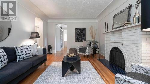 Coved ceiling accents - 985 Colborne Street, London, ON - Indoor Photo Showing Living Room With Fireplace