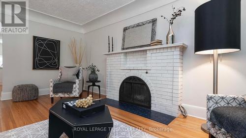 Lots of hardwoods throughout - 985 Colborne Street, London, ON - Indoor Photo Showing Living Room With Fireplace