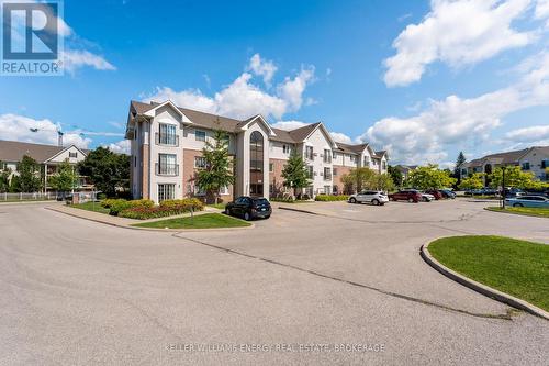 203 - 91 Aspen Springs Drive, Clarington (Bowmanville), ON - Outdoor With Facade