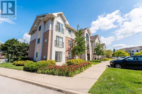 203 - 91 Aspen Springs Drive, Clarington (Bowmanville), ON - Outdoor With Facade