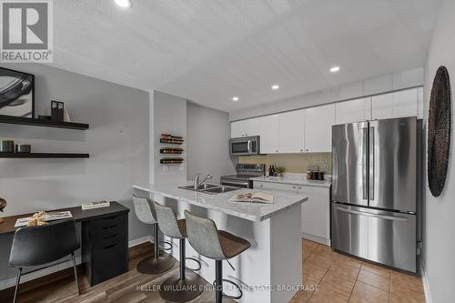 203 - 91 Aspen Springs Drive, Clarington (Bowmanville), ON - Indoor Photo Showing Kitchen With Stainless Steel Kitchen With Double Sink