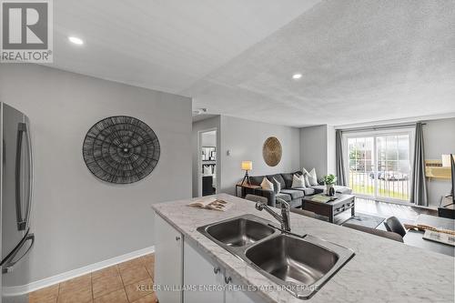 203 - 91 Aspen Springs Drive, Clarington (Bowmanville), ON - Indoor Photo Showing Kitchen With Double Sink