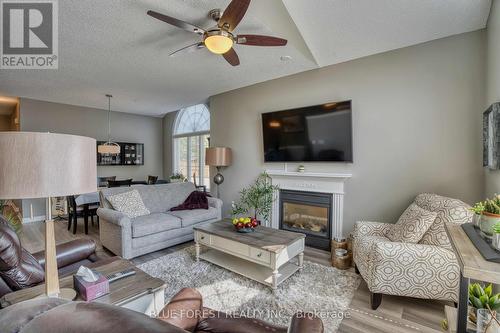 176 - 2025 Meadowgate Boulevard, London, ON - Indoor Photo Showing Living Room With Fireplace